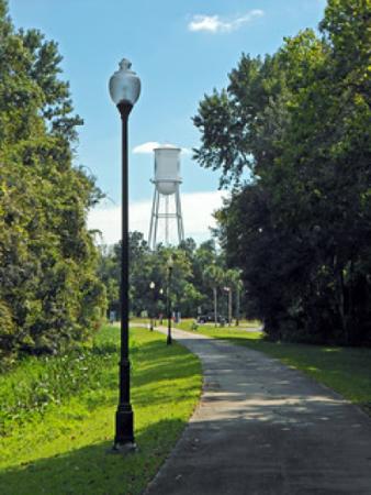 Crosstown trail with trail lamp on path and the defunct  water tower in background