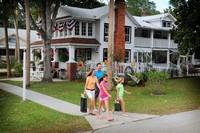A family finishes visiting at the Heritage House in downtown Crystal River.