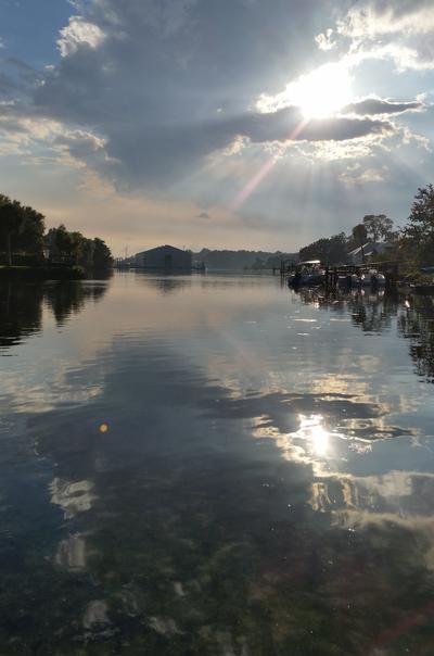 View of Pete's Pier from the water, water is clear and smooth surface